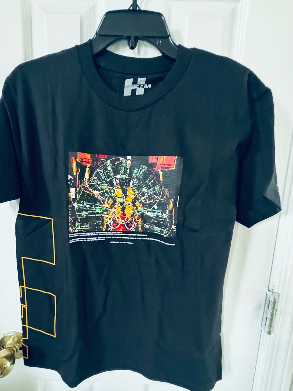 Hem Black Short Sleeve Graphic Tee with Yellow Accents